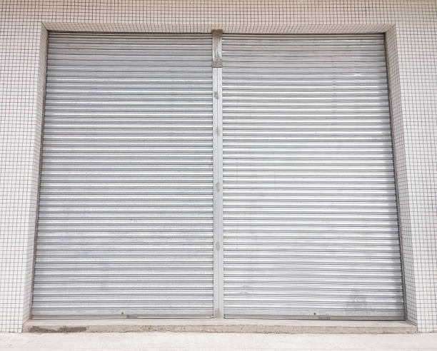 istock blank metal shutter doors on commercial shop front 498572607