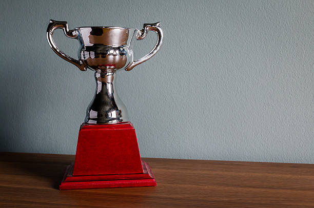 istock Still life with trophy on wood table 498572654