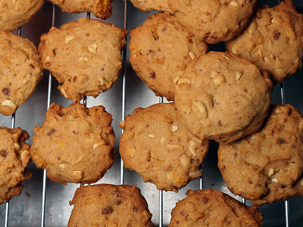 istock Cashew nut cookies on steel grid after oven 498576791