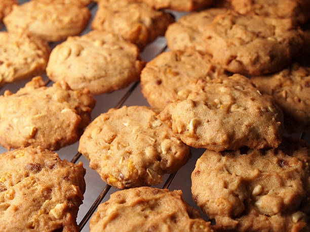 istock Cashew nut cookies on steel grid after oven 498576795