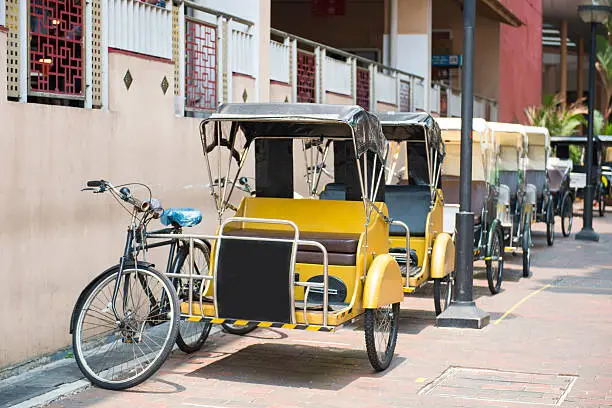 Pedicab service for travel in Singapore town , three-wheeler.