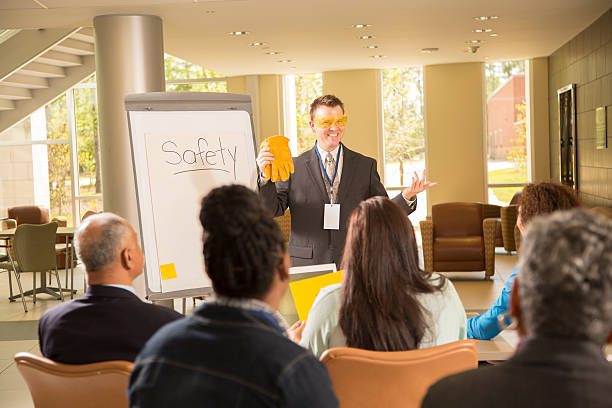 istock Safety in the workplace. Presentation with office workers. 498579195