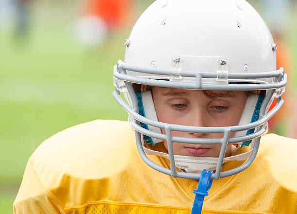 istock Young Football Player contemplating a loss 498579407