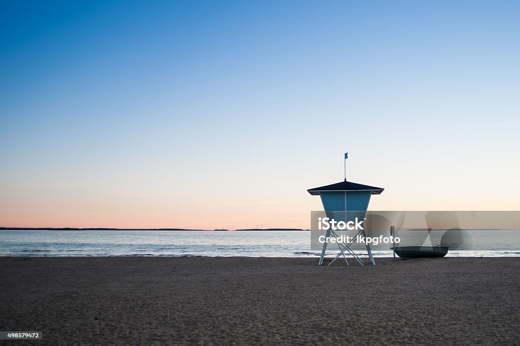 Lifeguard tower and a boat on the beach at sunset Lifeguard tower and a boat on the beach at sunset. 2015 Stock Photo