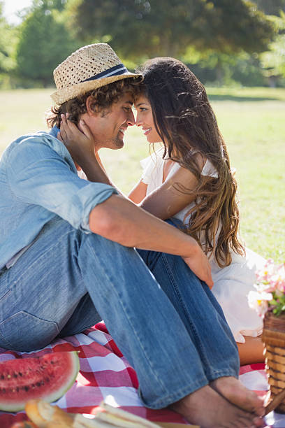 istock Young couple having a romantic picnic in the park 498579857