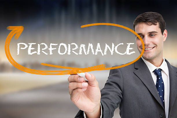 istock Businessman writing performance against cityscape 498579947