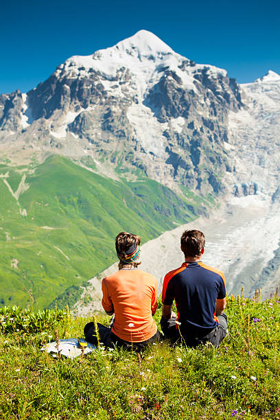 istock Hiker take a rest during hiking in Caucasus mountains, Georgia 498580008