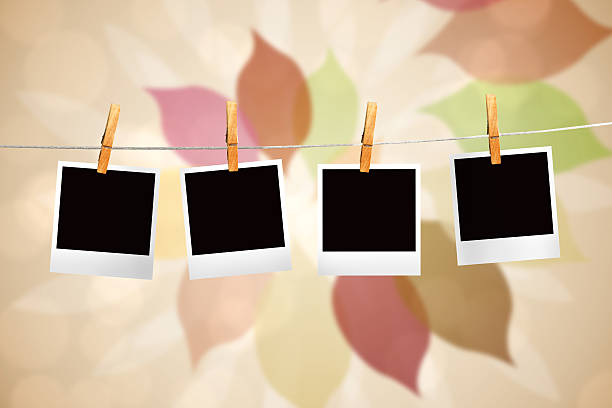 istock Composite image of clothes peg on line with instant photos 498580047