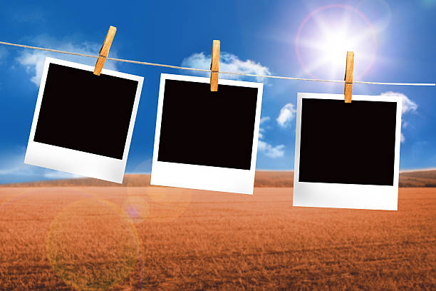 istock Composite image of clothes peg on line with instant photos 498580079