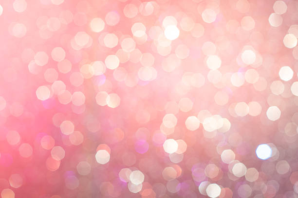 istock Christmas Glitter light bokeh blur Pink background abstract 498580685
