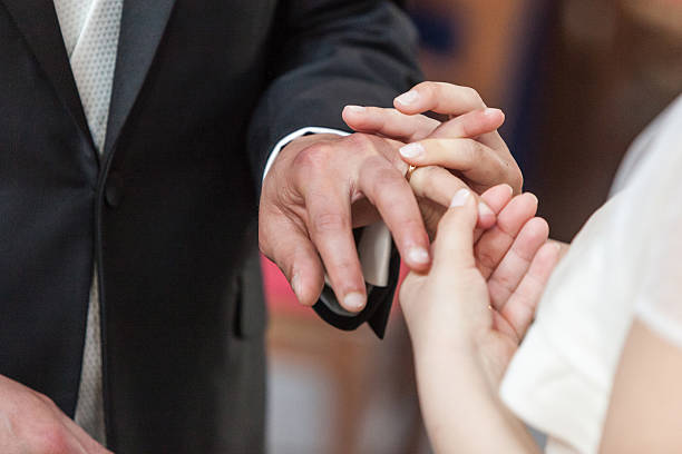 istock Bride and Groom with Wedding Rings 498581035