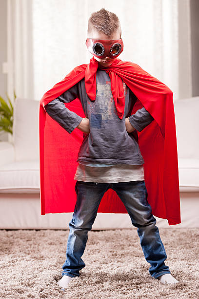 istock red cloak  kid livingroom superhero 498582055
