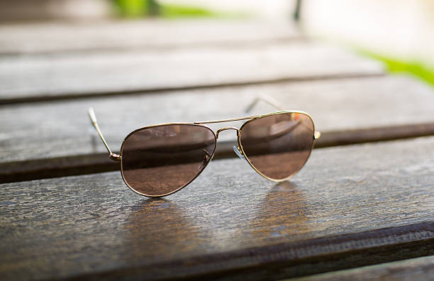 istock Aviator sunglasses on a wooden table 498583341