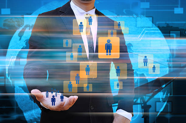 istock Businessman holding social network 498583483