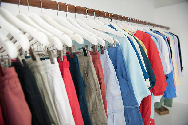 коллекция одежды - polo shirt multi colored clothing variation стоковые фото и изображения