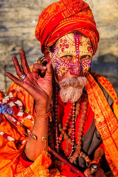 In Hinduism, sadhu, or shadhu is a common term for a mystic, an ascetic, practitioner of yoga (yogi) and/or wandering monks. The sadhu is solely dedicated to achieving the fourth and final Hindu goal of life, moksha (liberation), through meditation and contemplation of Brahman. Sadhus often wear ochre-colored clothing, symbolizing renunciation.http://bem.2be.pl/IS/nepal_380.jpg