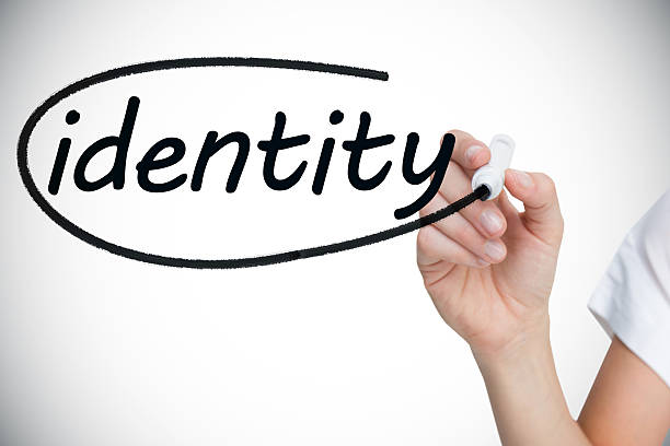 istock Businesswoman writing identity against white background 498596367