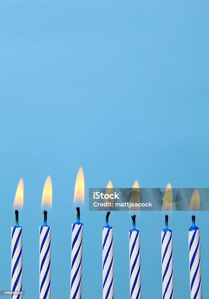 Birthday candles Birthday candles against blue background Anniversary Stock Photo