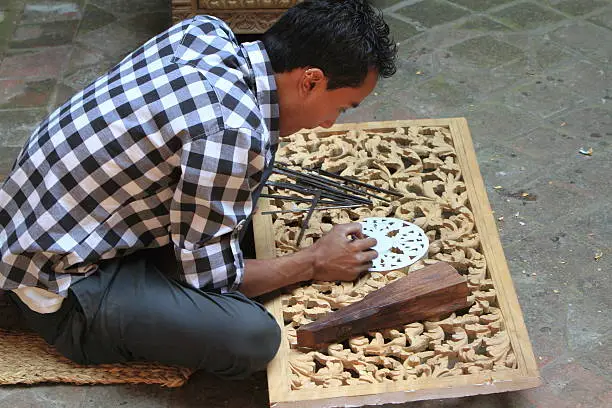 Craftsmen carving