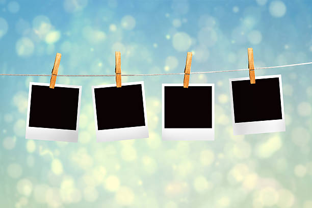 istock Composite image of clothes peg on line with instant photos 498597189