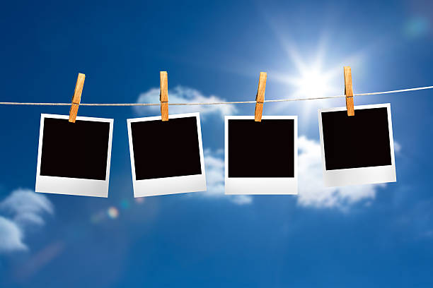 istock Composite image of clothes peg on line with instant photos 498597191