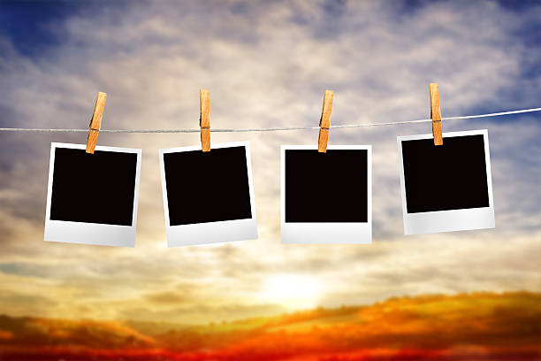 istock Composite image of clothes peg on line with instant photos 498597199