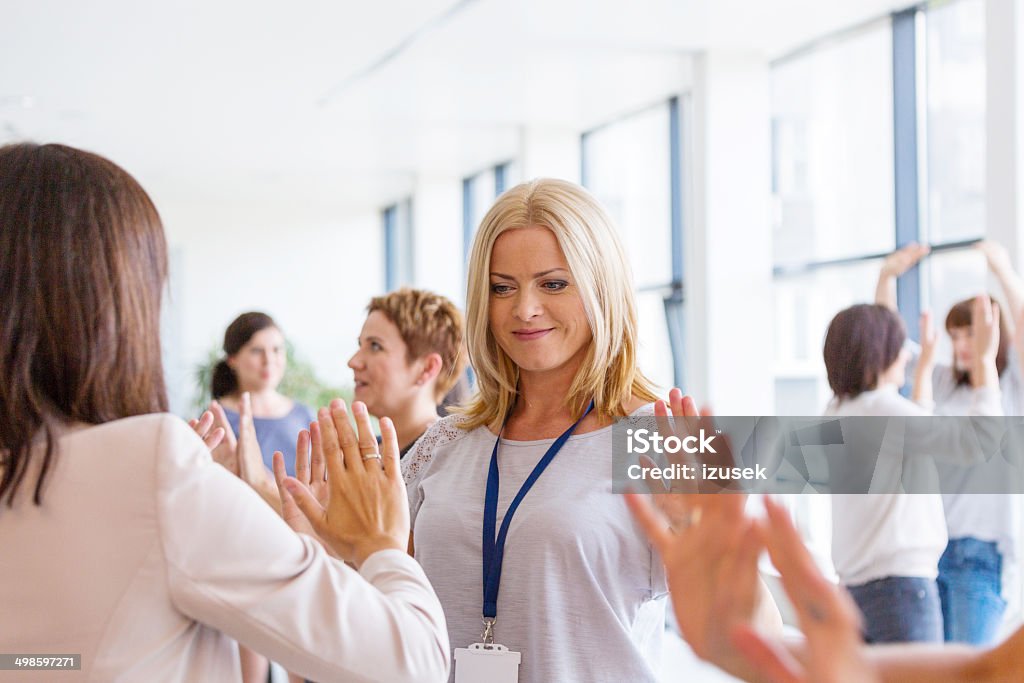 Group of women at the training Group of women attending a training, playing together.  30-39 Years Stock Photo