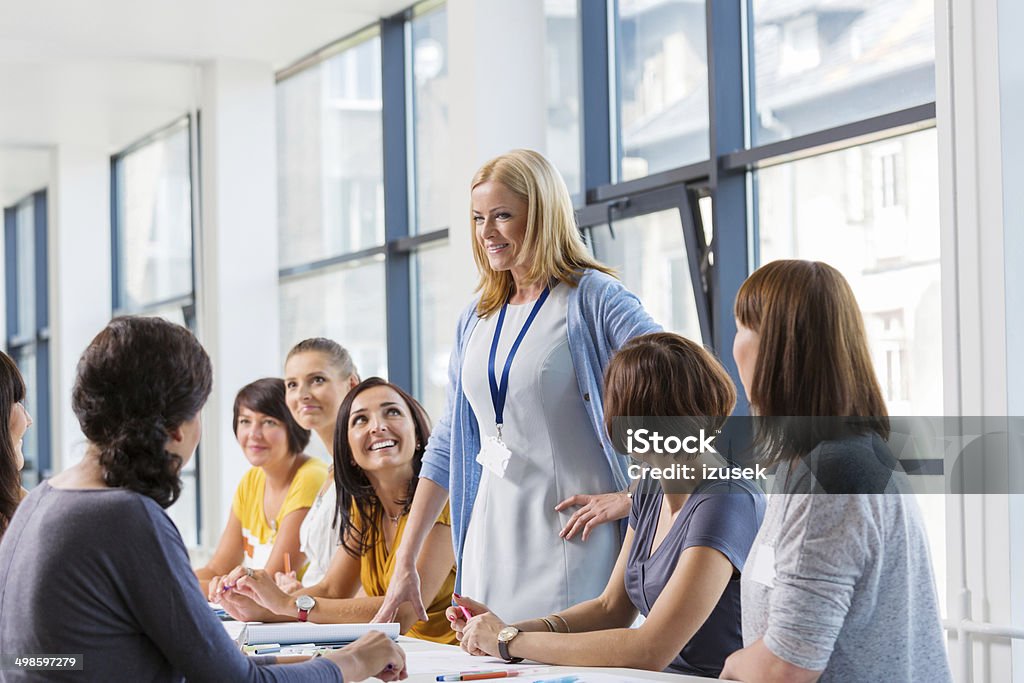 Group of women at the training Group of smiling women attending a training, working together and discussing. 30-39 Years Stock Photo