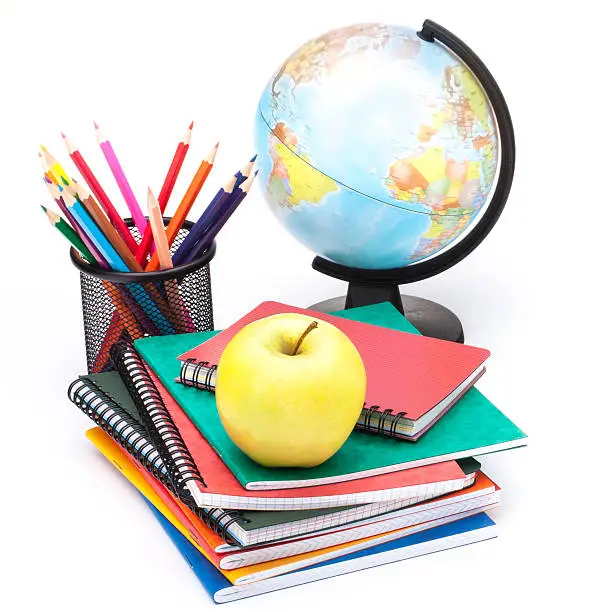 Photo of Globe, notebook stack and pencils