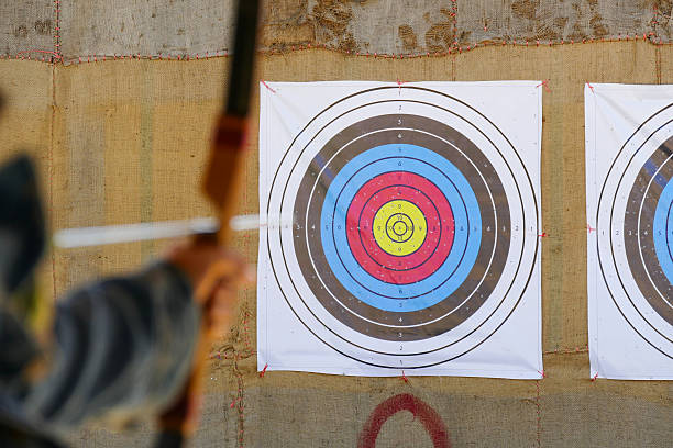 istock archer is aiming the archery at the target 498601586