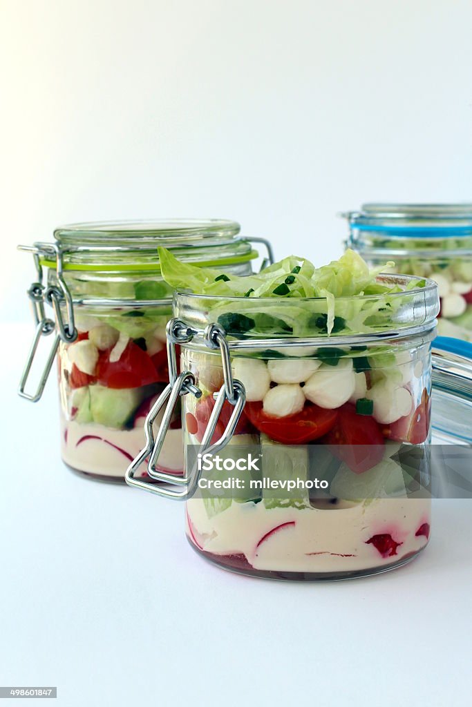 Salad in jars Salad in jars isolated in white Appetizer Stock Photo