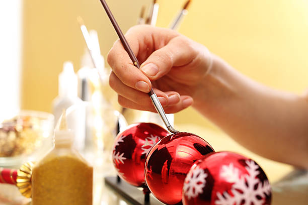 istock Christmas preparations, the woman preparing decorations. 498602344