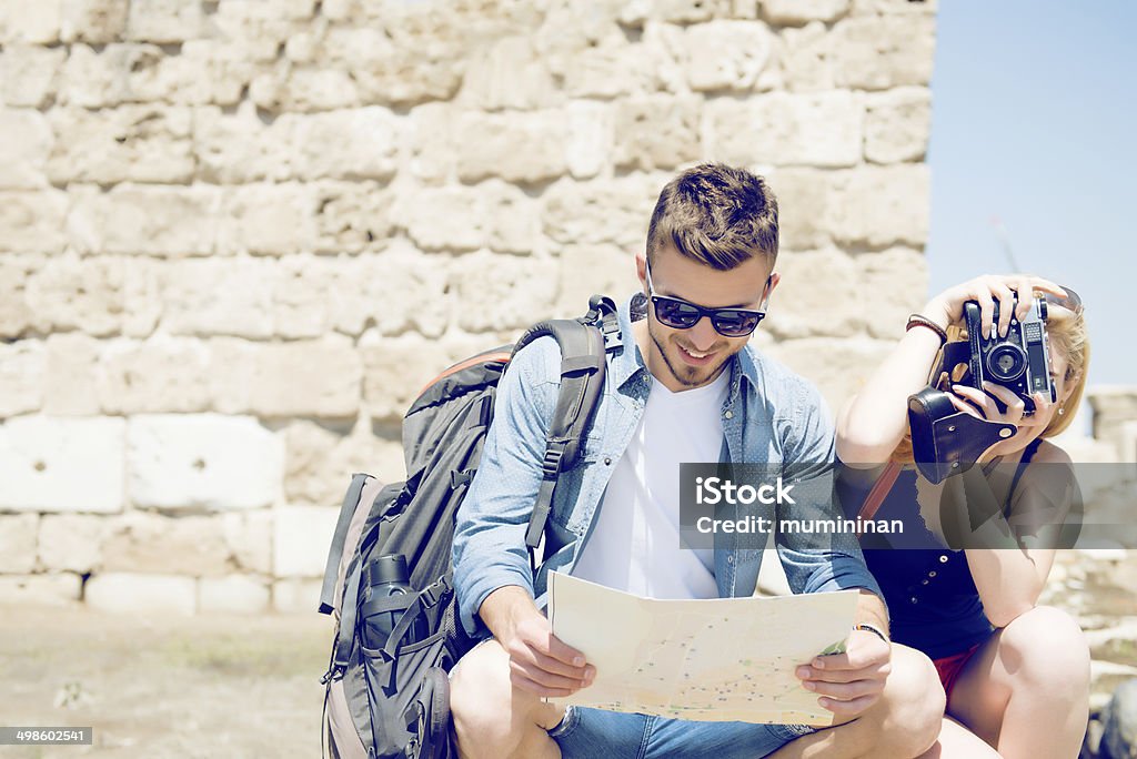 tourist couple photo attracts tourist couple 20-24 Years Stock Photo