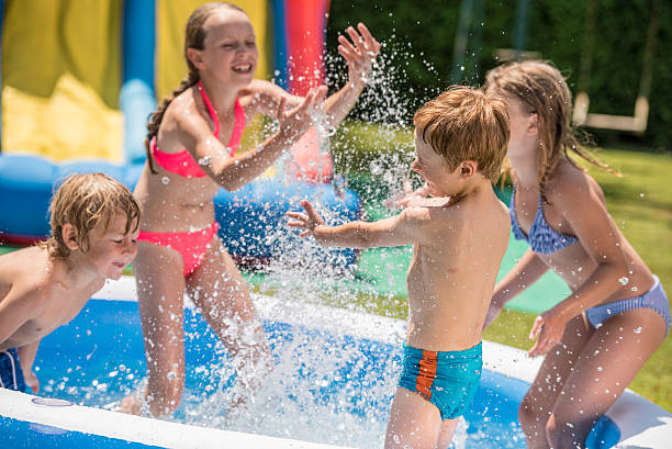 istock Children having fun in paddling pool 498604080