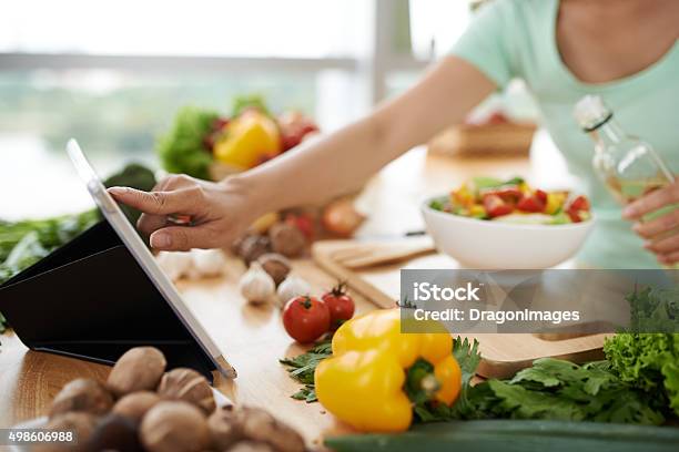 Checking Recipe Stock Photo - Download Image Now - Cooking, Recipe, Mobile App