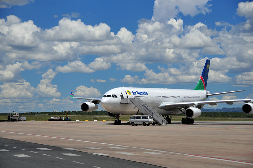 Windhoek, Namibia - February 14, 2010: an Air Namibia jet waits for passenger boarding on the tarmac at Windhoek Airport,