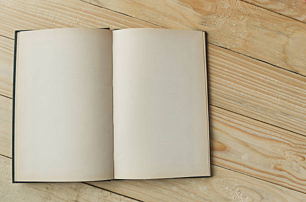 istock blank paper on wooden table background 498609810