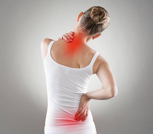 Nape pain Spine osteoporosis. Scoliosis. Spinal cord problems on woman's back. back pain stock pictures, royalty-free photos & images