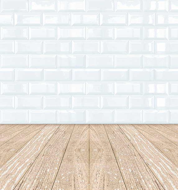istock White Ceramic brick tile wall and wooden floor 498610447