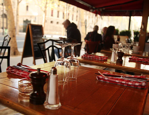 istock table with cutlery and glasses in a Paris cafe 498611335