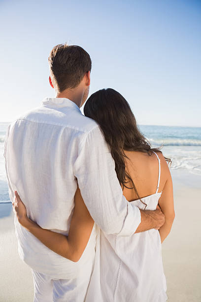 istock Content couple looking at the ocean 498611437