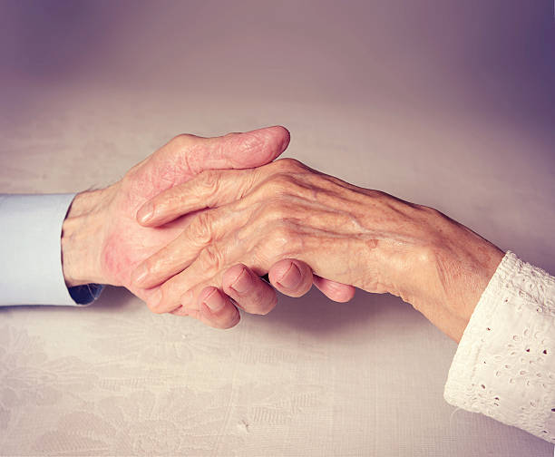 istock Old people holding hands, Closeup. 498611481