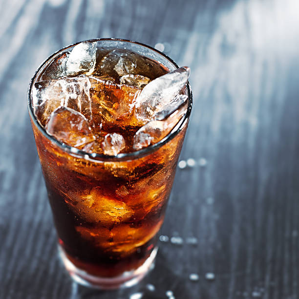 istock glass of cola with ice with copyspace in composition 498612241