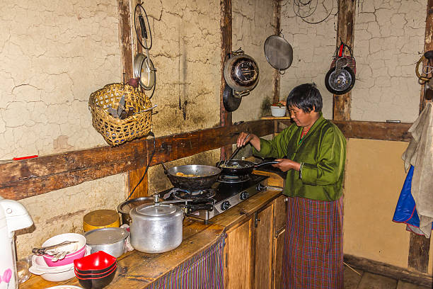 istock bhutanese woman in  the kitchen 498612445