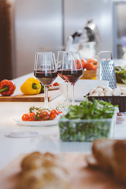 istock Vegetable, glass wine, utensils on the kitchen table 498614568