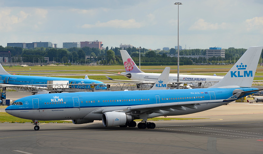Schiphol, The Netherlands - June 22, 2014: KLM Royal Dutch Airlines Airbus A330 taxiing at Schiphol Airport in The Netherlands. KLM - Koninklijke Luchtvaart Maatschappij N.V. (Royal Dutch Airlines), is the flag carrier airline of the Netherlands.