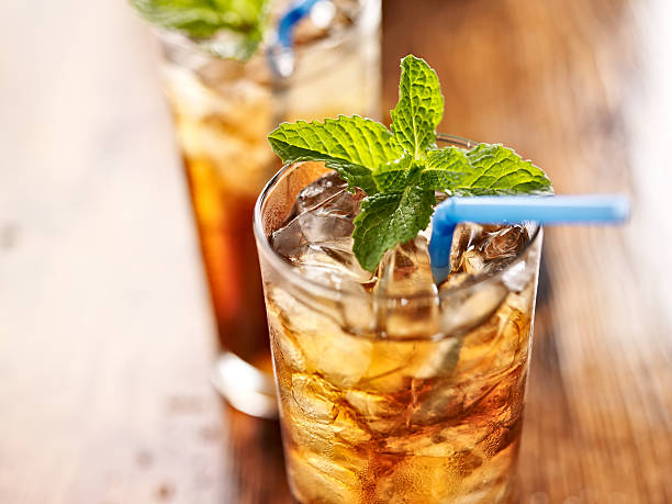 istock iced sweet tea with blue straw 498615429