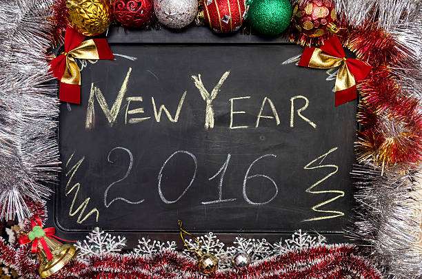 istock 2016 Happy New Year written on blackboard with decorations 498615748