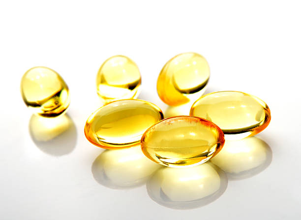 istock Fish oil pill on white background 498615773
