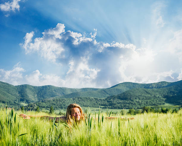 istock young woman having some fun in the wheat field 498616243